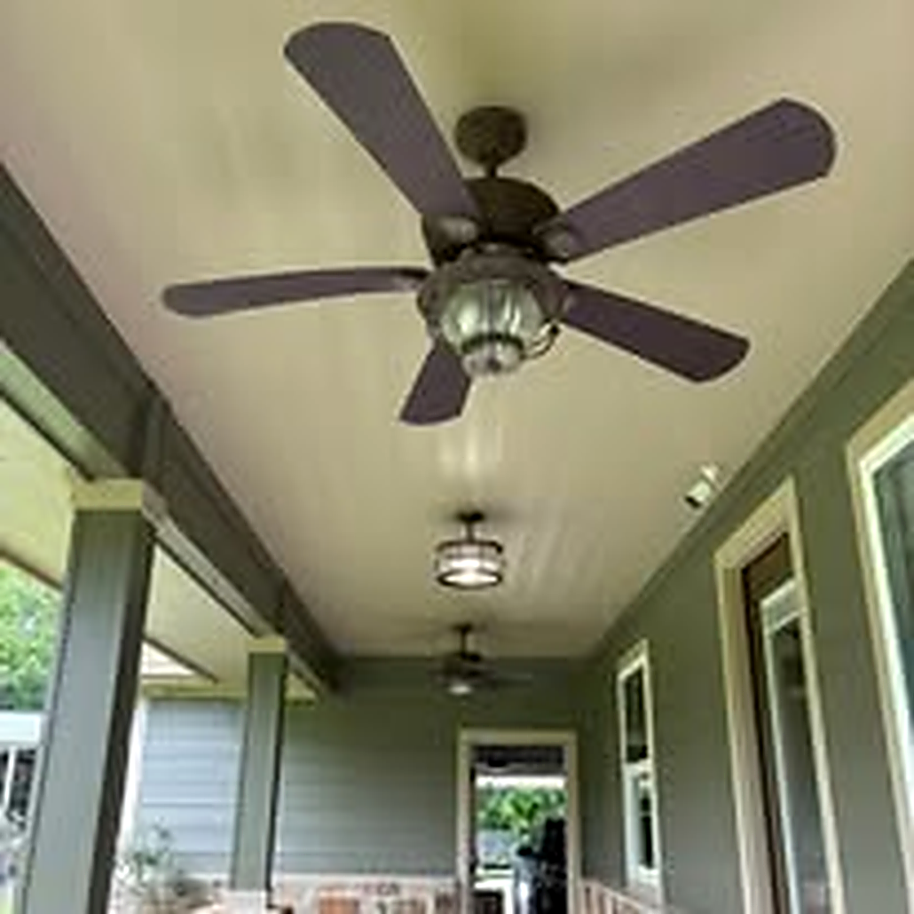 New outdoor ceiling fan installed on a covered patio in Deer Park TX