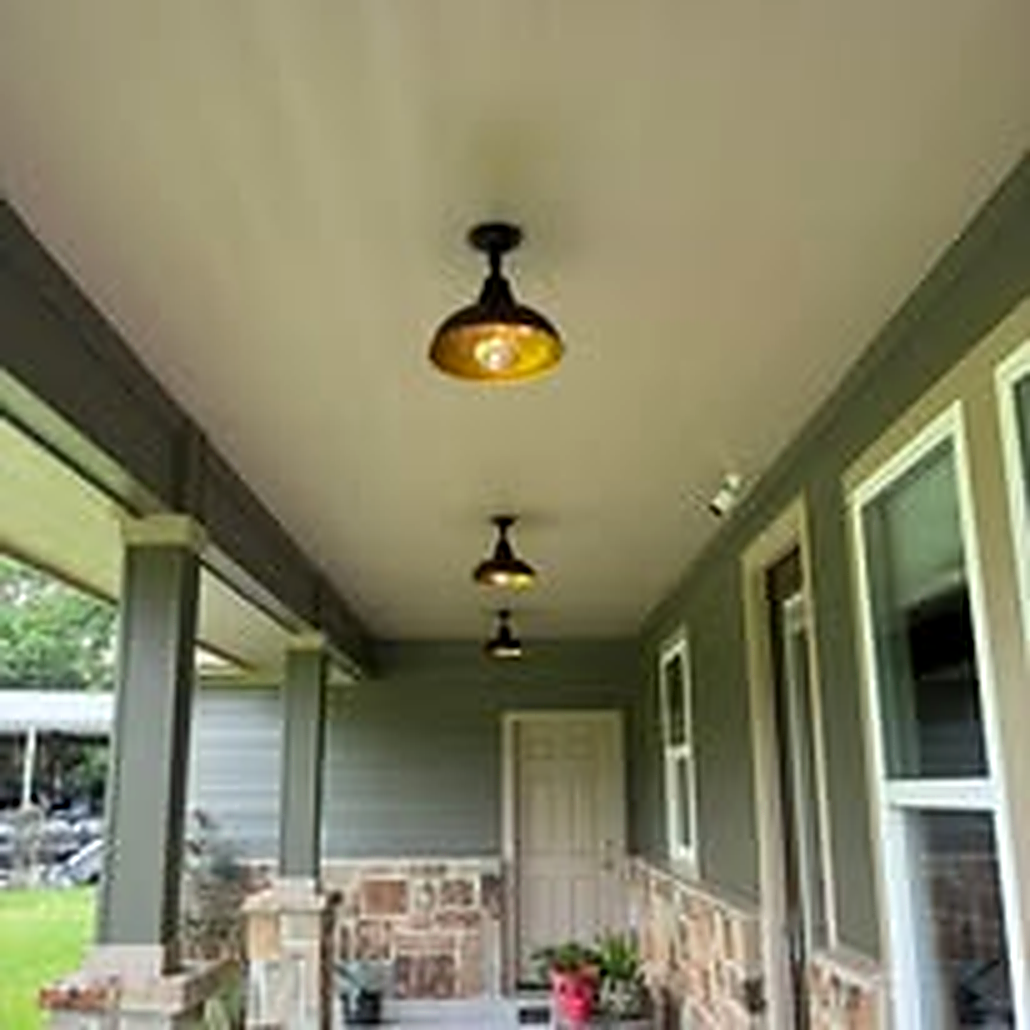 Farmhouse-style porch light fixtures installed on a covered porch in Baytown TX